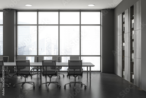 Stylish conference room interior with table and shelf with panoramic window © ImageFlow