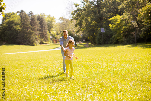 Father chasing his little d...