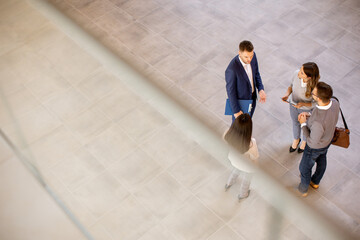 Aerial view at business people team discussing in the office hallway