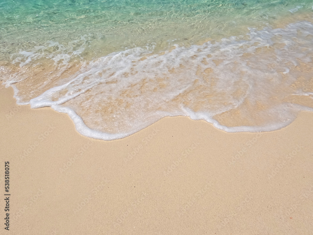 Natural scenery of beautiful tropical beaches and sea on a clear day. Light blue ocean waves on clean sandy beach. Natural scenery of beautiful tropical beaches and sea on a clear day. Light blue ocean waves on clean sandy beach.