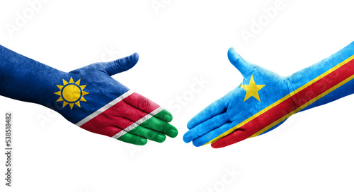 Handshake between Dr Congo and Namibia flags painted on hands, isolated transparent image.