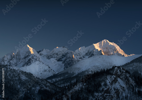 Mountain peaks covered with snow. Mountains in winter © Ivan