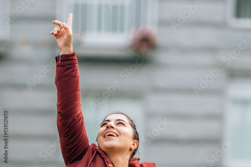 girl smiling excited with happiness in the street photo