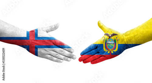 Handshake between Ecuador and Faroe Islands flags painted on hands, isolated transparent image.