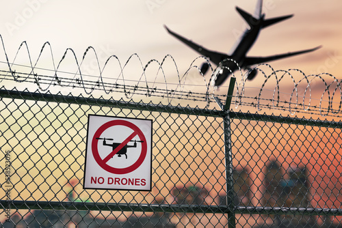 No drone zone sign near airport warning about restricted no fly area. photo