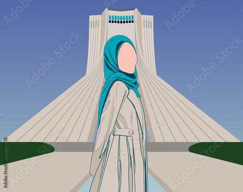 Iranian Muslim girl wearing hijab posing for photo with head turned to right in front of Azadi Tower in Tehran