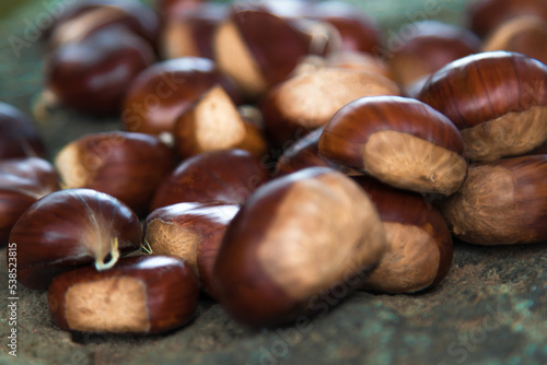 group of stacked natural chestnuts