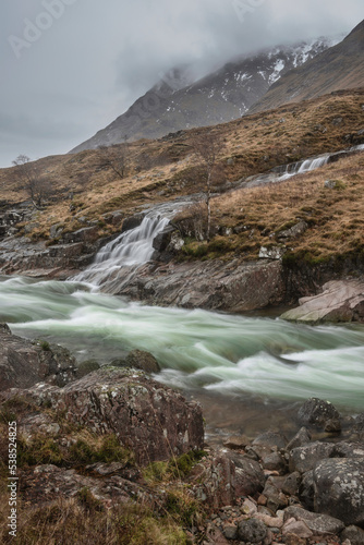 Stunning Winter landscape image of River Etive and Skyfall Etive Waterfalls in Scottish Highlands