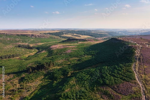 Stunning vibrant late Summer aerial drone landscape image of heather in full bloom in Peak District © veneratio