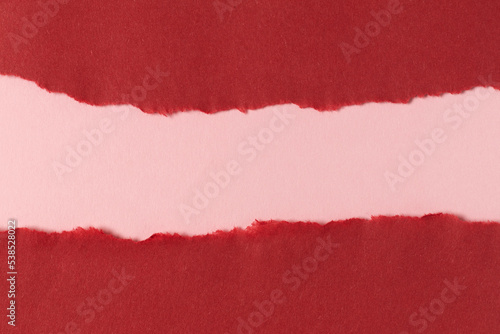 Red pink cardboard paper background. Full frame texture.