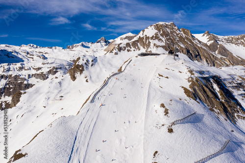 Anzere, Switzerland: Aerial view of the Anzere ski resort slopes in Canton Valais in the Swiss alps on a sunny winter day