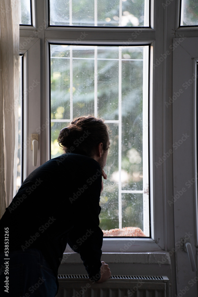 sad person watching outside from window sad person watching outside from window