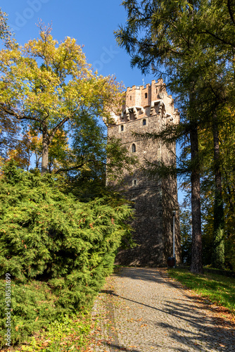 Piast Tower in Cieszyn among colorful autumn trees on a sunny day