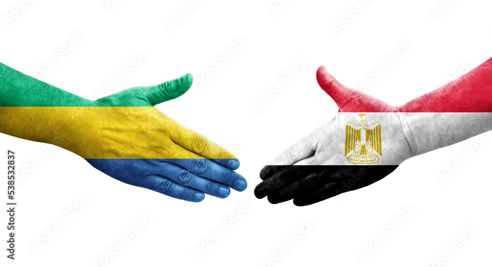 Handshake between Egypt and Gabon flags painted on hands, isolated transparent image.