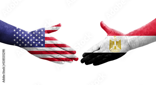 Handshake between Egypt and USA flags painted on hands, isolated transparent image.