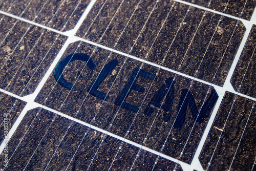 A dirty solar panel with the word 