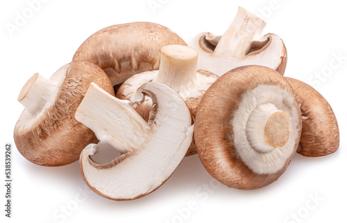 Brown cap champignons with slices of champignon mushroom isolated on white background. Close-up.