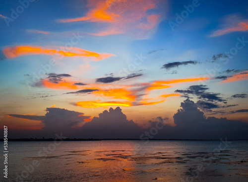 sunset over the ocean © Sadaf