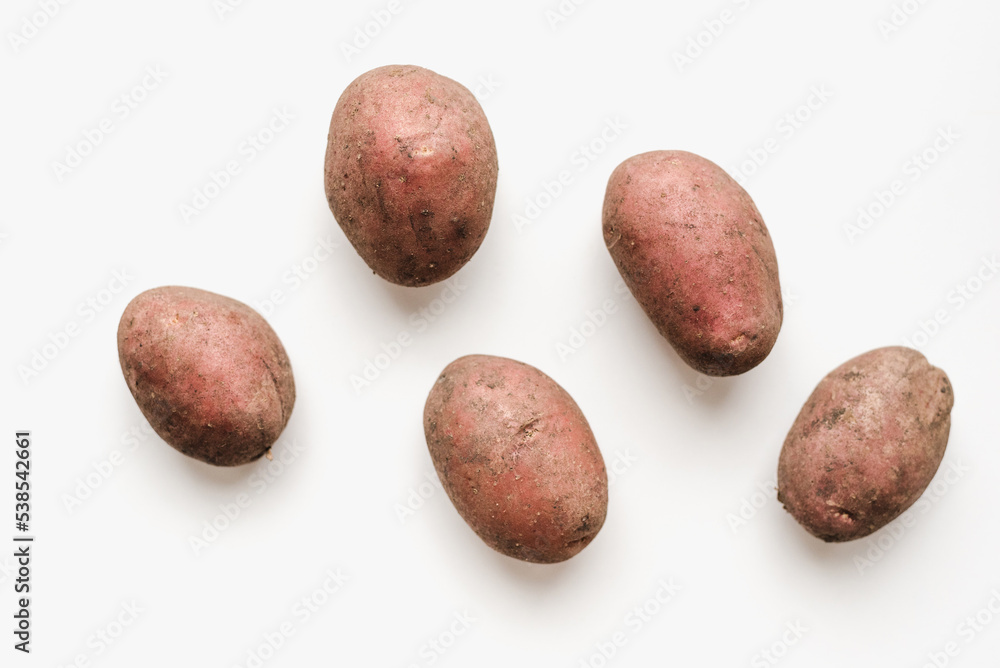 Potato on a white background. New potatoes. Potato on a white background. New potatoes.