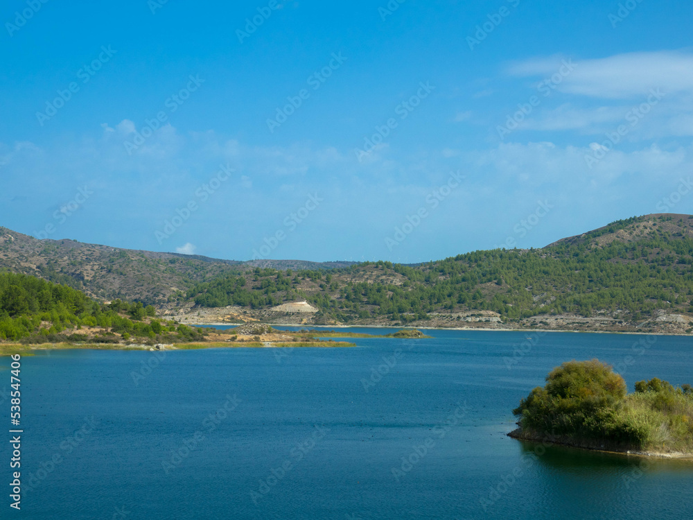 Panoramic view of Gadouras Dam. Solving the important and crucial water supply problems.
Near the villages of Lardos and Laerma in the southern part of the island. Rhodes, Greece. Panoramic view of Gadouras Dam. Solving the important and crucial water supply problems.
Near the villages of Lardos and Laerma in the southern part of the island. Rhodes, Greece.