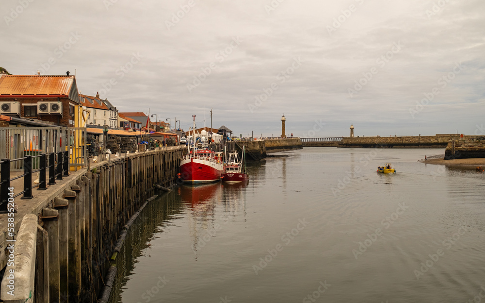 A view down the quayside and harbour in the seaside town of Whitby, North Yorkshire