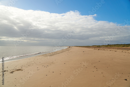 Long wide beach and sea landscape scene