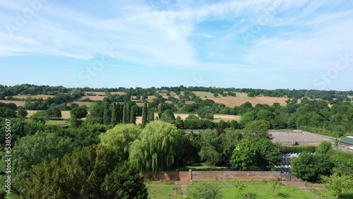 Aerial top down view from the drone on the narrow passageway leading to a small chapel. Chapel located in a big green open area of fields near Rosary Manor, Mill Hill, North West London, London, UK. photo