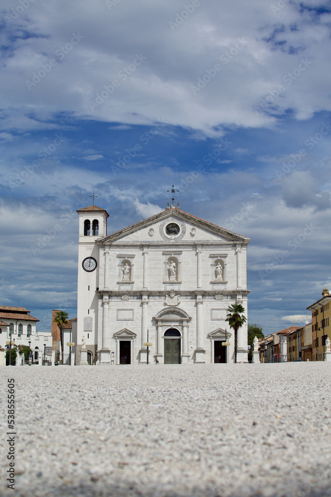 The Doge's Cathedral of Palmanova with its imposing bell tower is overlooking Piazza Grande