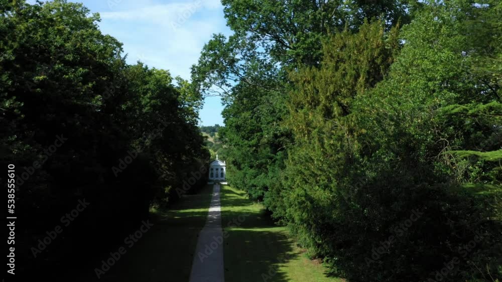 Aerial top down view from the drone on the narrow passageway leading to a small chapel. Chapel located in a big green open area of fields near Rosary Manor, Mill Hill, North West London, London, UK.