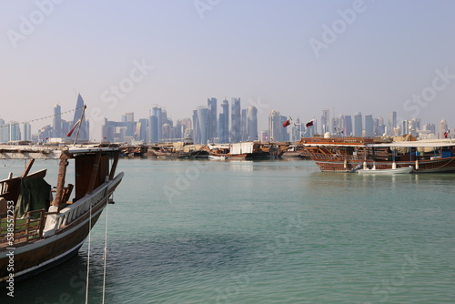 Cityscape with old boats on skyscrapers from the Corniche in Doha, Qatar