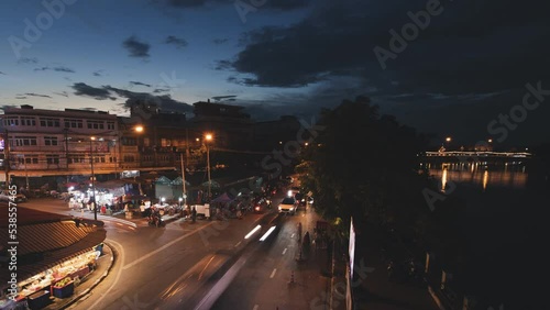 Night time traffic street at junction with cars light, top view 4k timelapse. Cars driving at high speed. photo