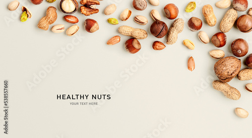 Obraz na plátně Mixed nuts on bright background. Creative layout. Color card.