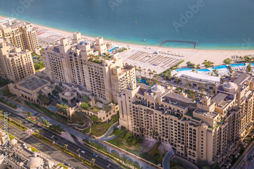 Dubai Marina apartments complex  at sunset view with beaches. Yachts and speed boats on the pier. Dubai, UAE © IRStone