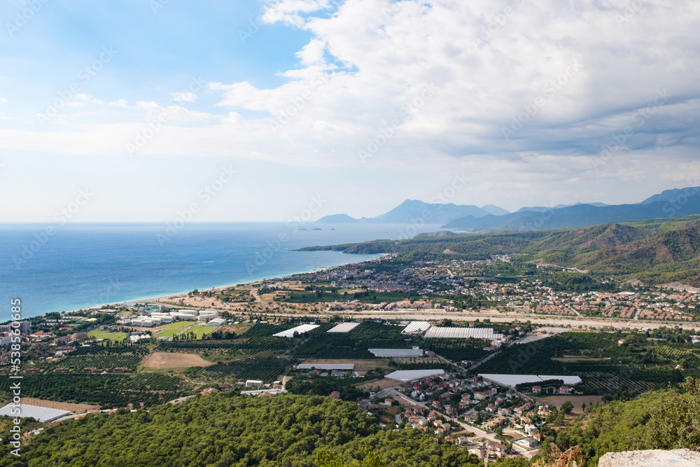 View from the top of the mountain to the city of Kirish, the Mediterranean Sea and mountains. Beautiful mountain seascape. View from the top of the mountain to the city of Kirish, the Mediterranean Sea and mountains. Beautiful mountain seascape.