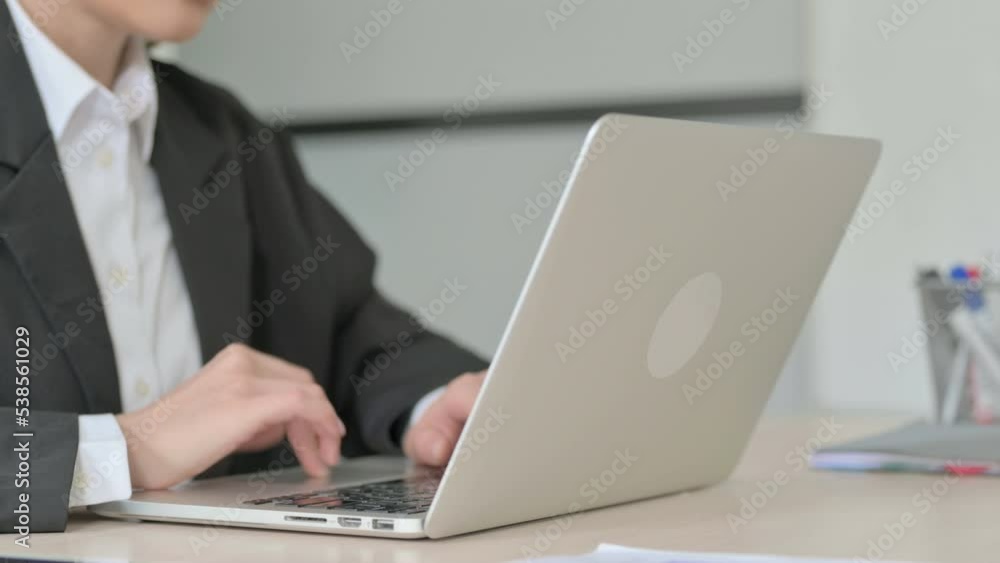 Close Up of Young Businesswoman Working on Laptop Close Up of Young Businesswoman Working on Laptop