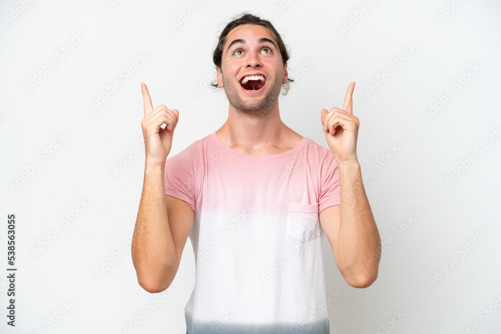 Caucasian handsome man isolated on white background surprised and pointing up Caucasian handsome man isolated on white background surprised and pointing up