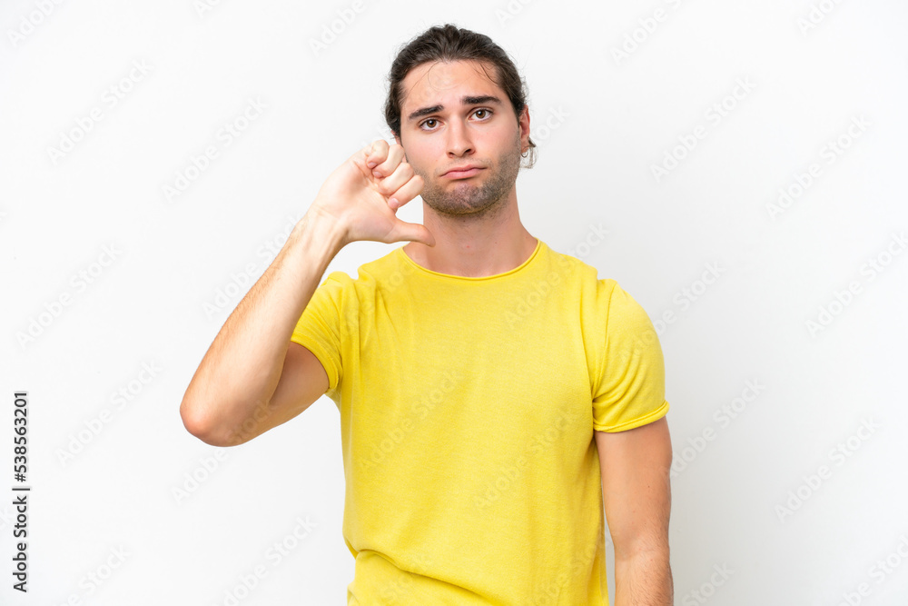 Caucasian handsome man isolated on white background showing thumb down with negative expression Caucasian handsome man isolated on white background showing thumb down with negative expression
