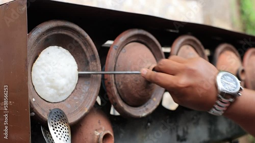 Making Surabi Bandung using Traditional Earthen Ware photo