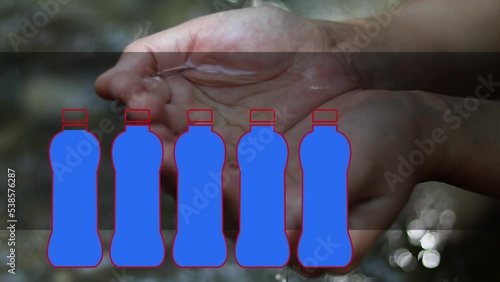 A woman's hands with water. The concept of water shortages coming up in the future.
 photo