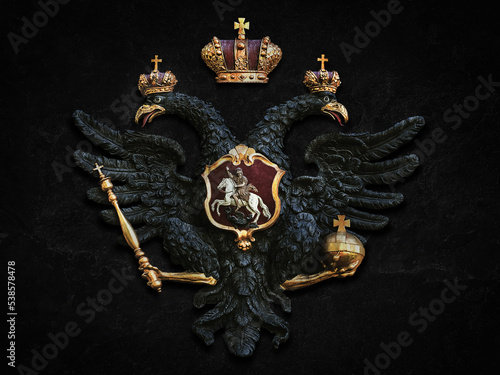 Russian double-headed eagle on a dark vintage background photo