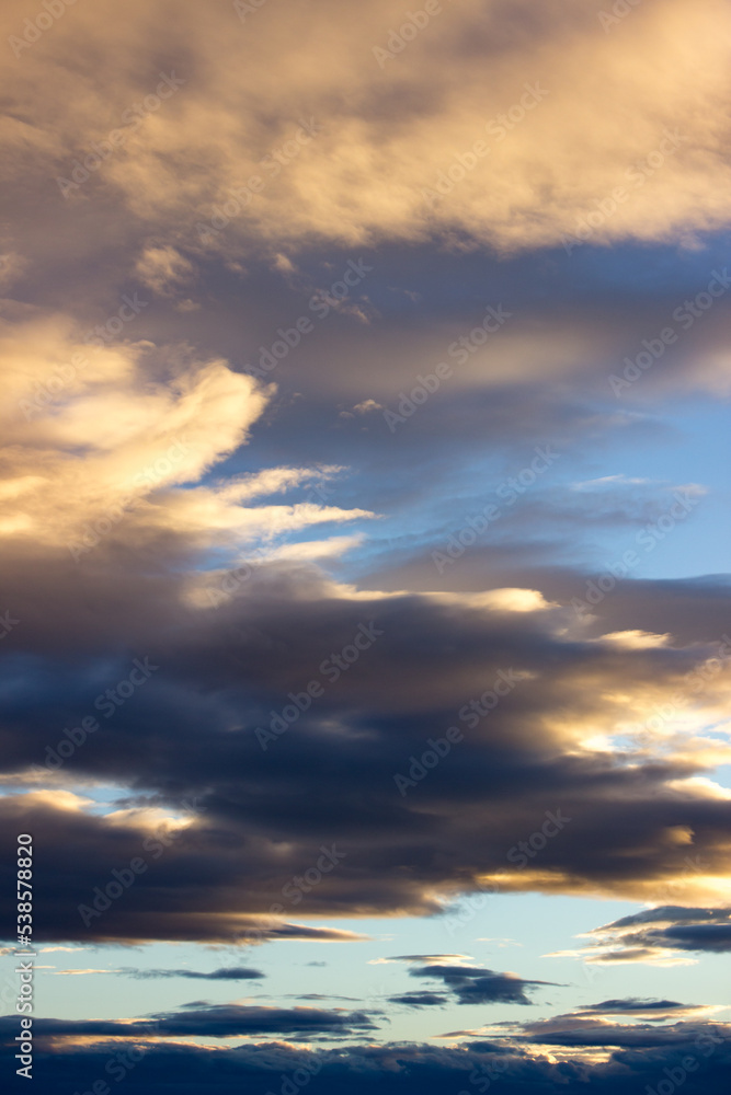 Beautiful evening sky background. Clouds in the sky during the sunset.
