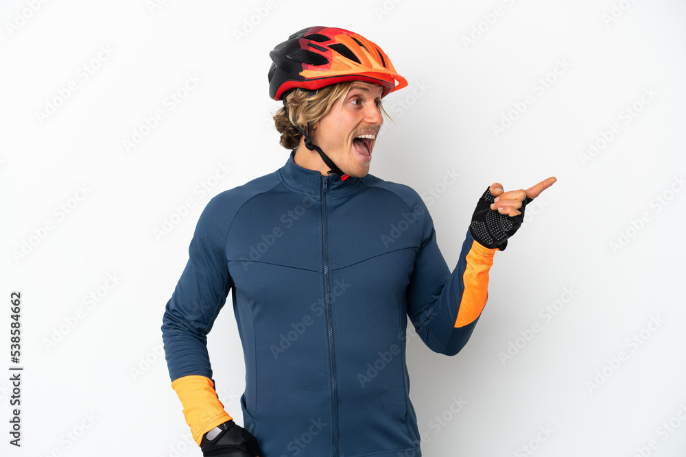 Young blonde cyclist man isolated on white background intending to realizes the solution while lifting a finger up Young blonde cyclist man isolated on white background intending to realizes the solution while lifting a finger up