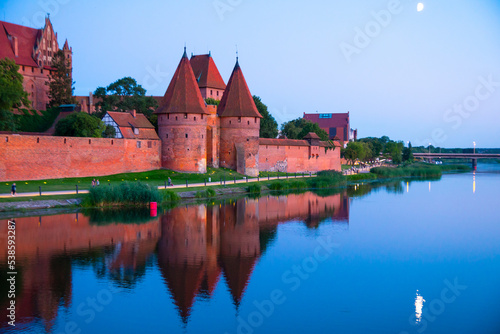 Marienburg castle the largest medieval brick castle in the world in the city of Malbork evening view at night