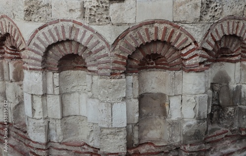 A fragment of an ancient, stone wall, used for the background.