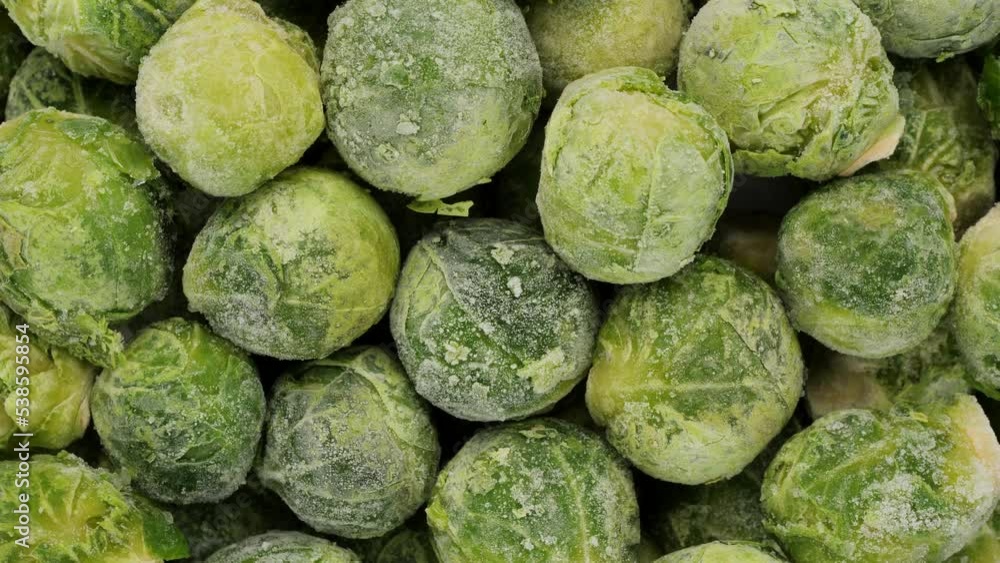 Frozen Brussels sprout top view, rotation. Healthy vegan food concept Frozen Brussels sprout top view, rotation. Healthy vegan food concept