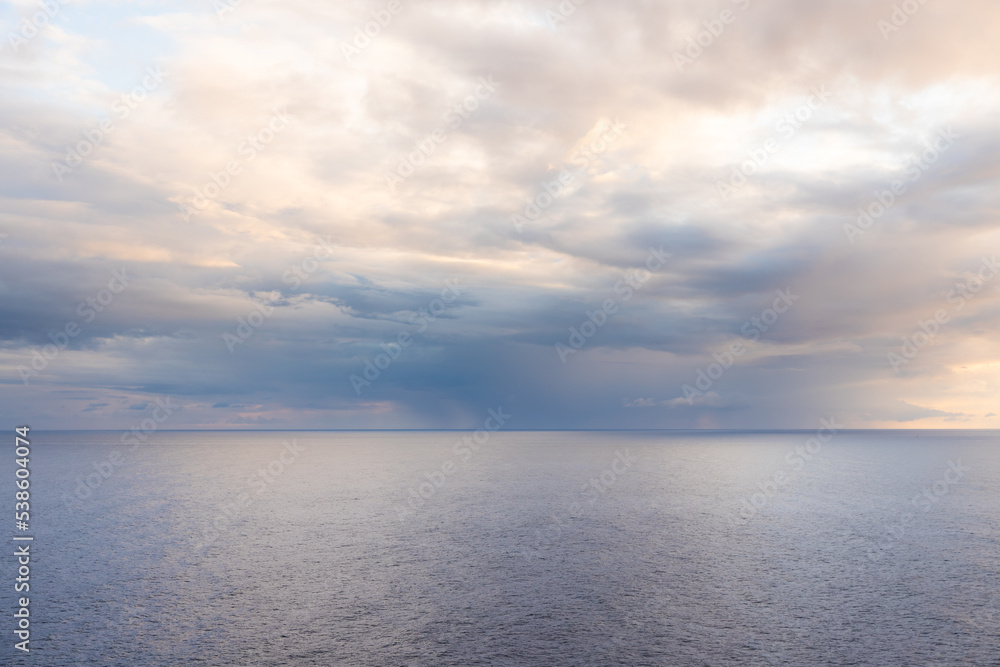 Sunrise on the sea background. Beautiful sunrise at the calm sea in light blue color Sunrise on the sea background. Beautiful sunrise at the calm sea in light blue color