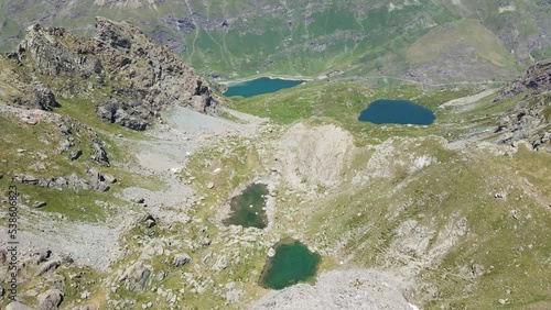 Drone aerial view of the highlands with rocky mountains and Malciaussia lakes on a sunny day. Viù valley, Usseglio (Italian Alps) photo