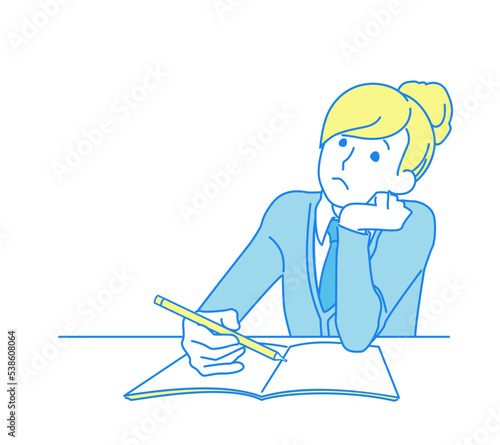 勉強に集中できずに頬杖をつく女の子