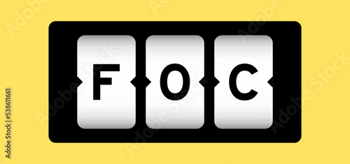 Black color in word FOC (Abbreviation of Free of charge) on slot banner with yellow color background photo