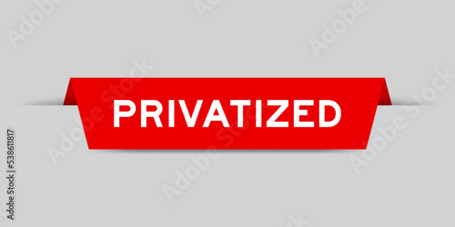 Foto Red color inserted label with word privatized on gray background
